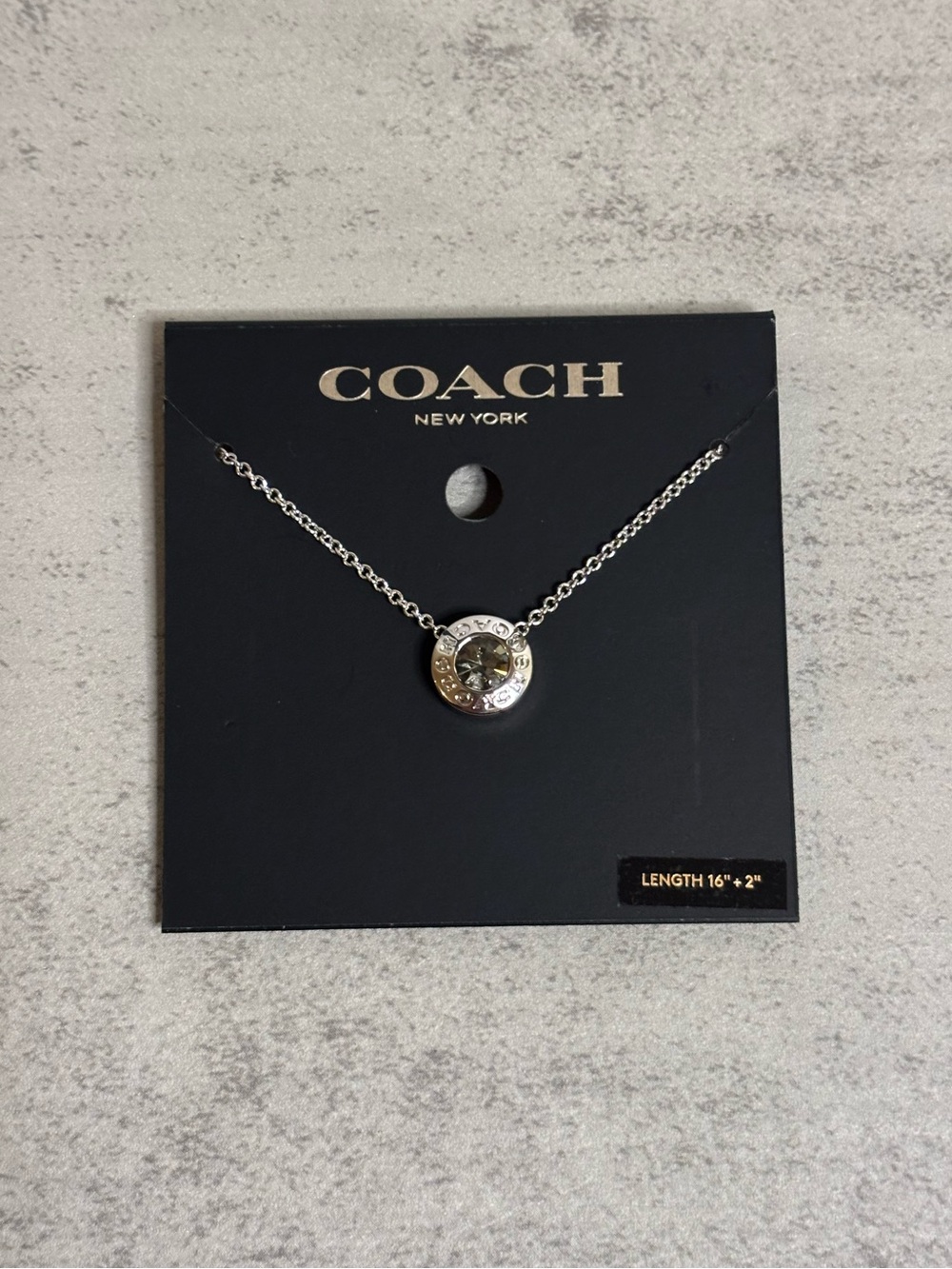 Coach Silver Signature Circle Pendant Necklace in Gray Crystal